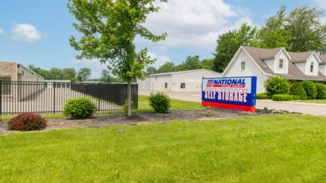 Storage facility sign and exterior units at National Storage in Monroe, MI.