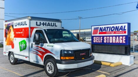 National Storage Lakewood rentable U-Haul parked near facility sign.