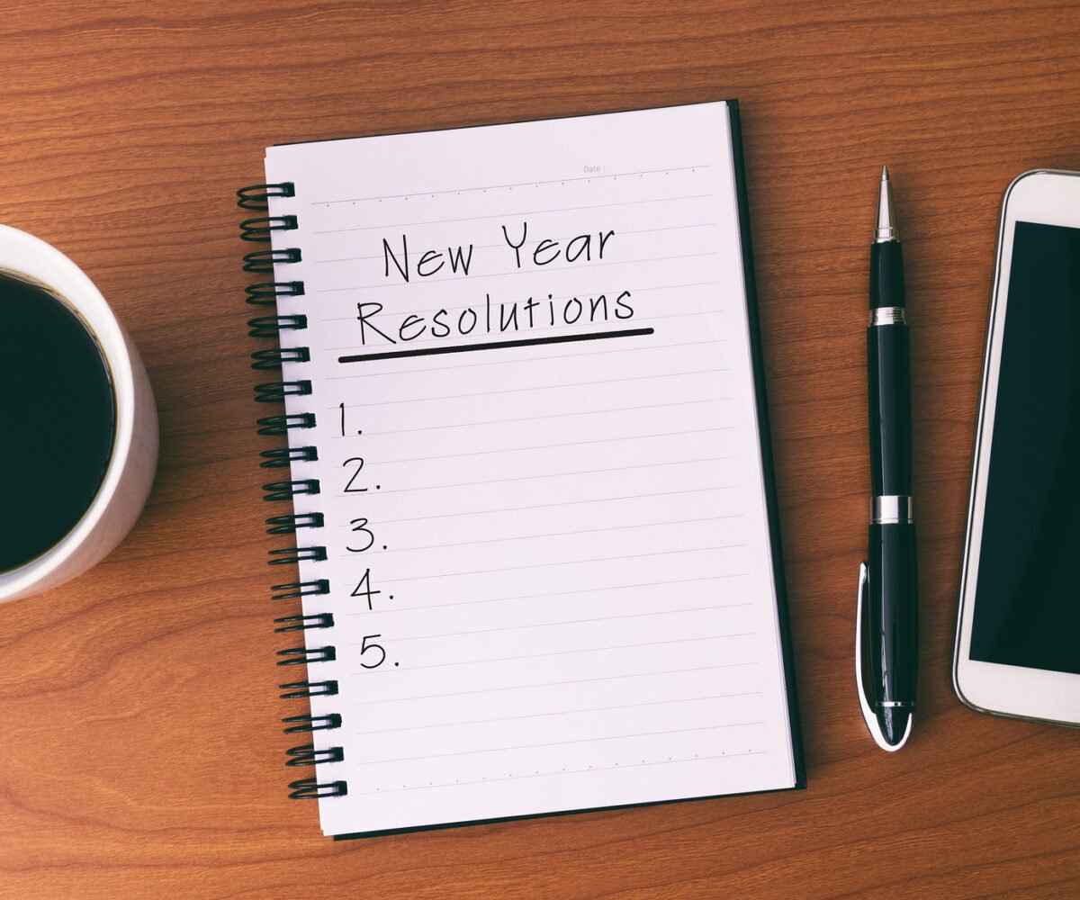 A journal with a New Year's resolutions list.