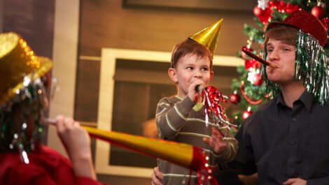 A family enjoying a New Year’s Eve celebration.