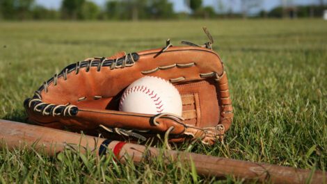 Baseball equipment on a grass field.
