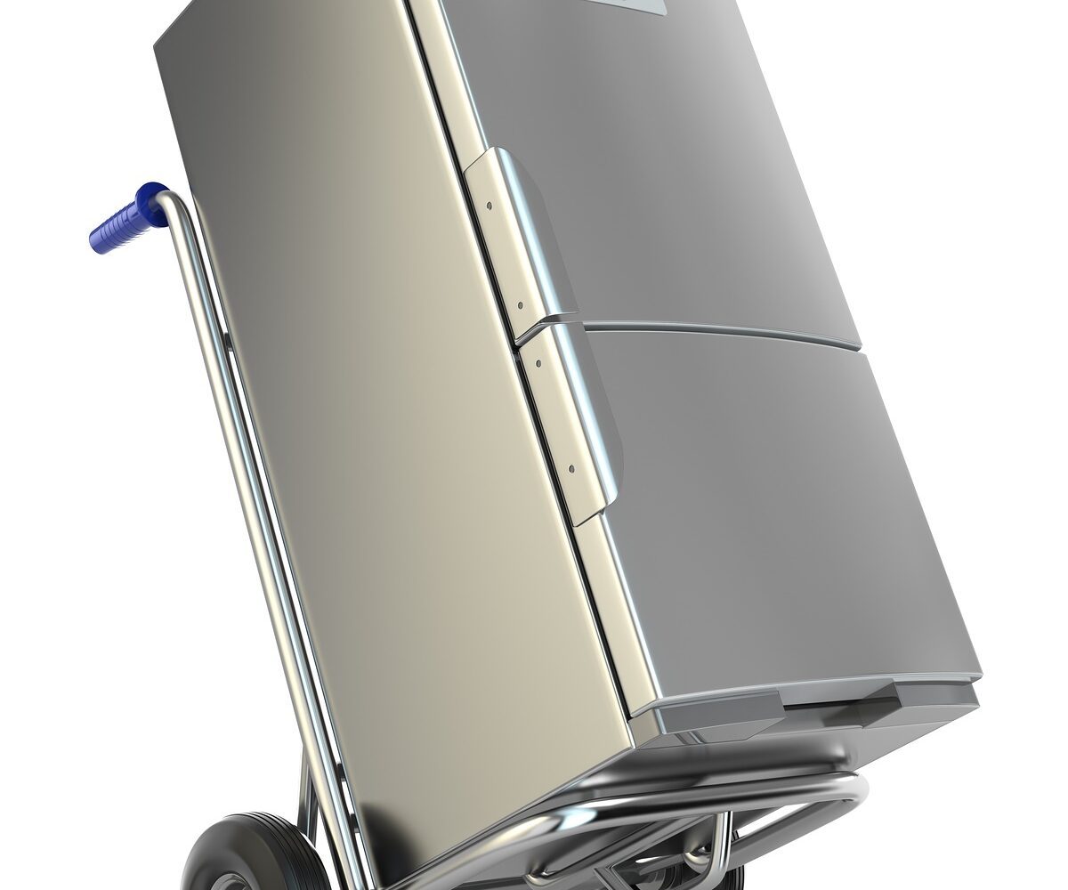 A refrigerator on a moving dolly.