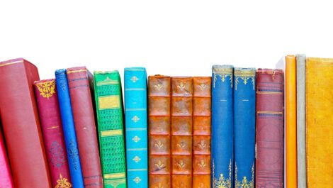 Books sitting on a bookshelf.