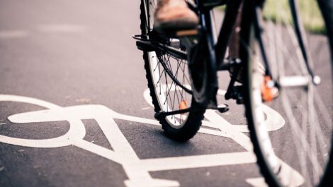 Person riding a bike in a bicycle lane.