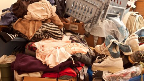 A large pile full of clothes and shoes.