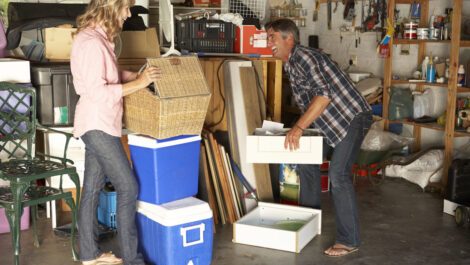 A couple cleaning out their garage.