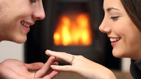 Young couple looking at an engagement ring.