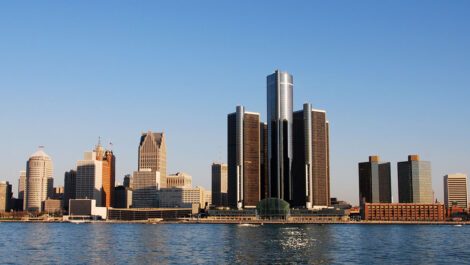 Detroit skyline during the daytime next to lake.