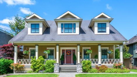 Front of a luxury home on a sunny day.