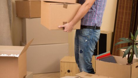 Man carrying moving boxes.