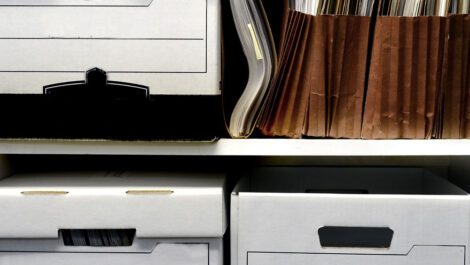 Office shelves full of files and boxes.