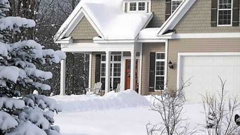 A house covered in a blanket of snow.