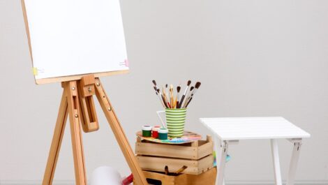 An art easel and paint supplies.