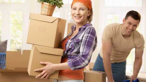 Young couple moving out of their house.